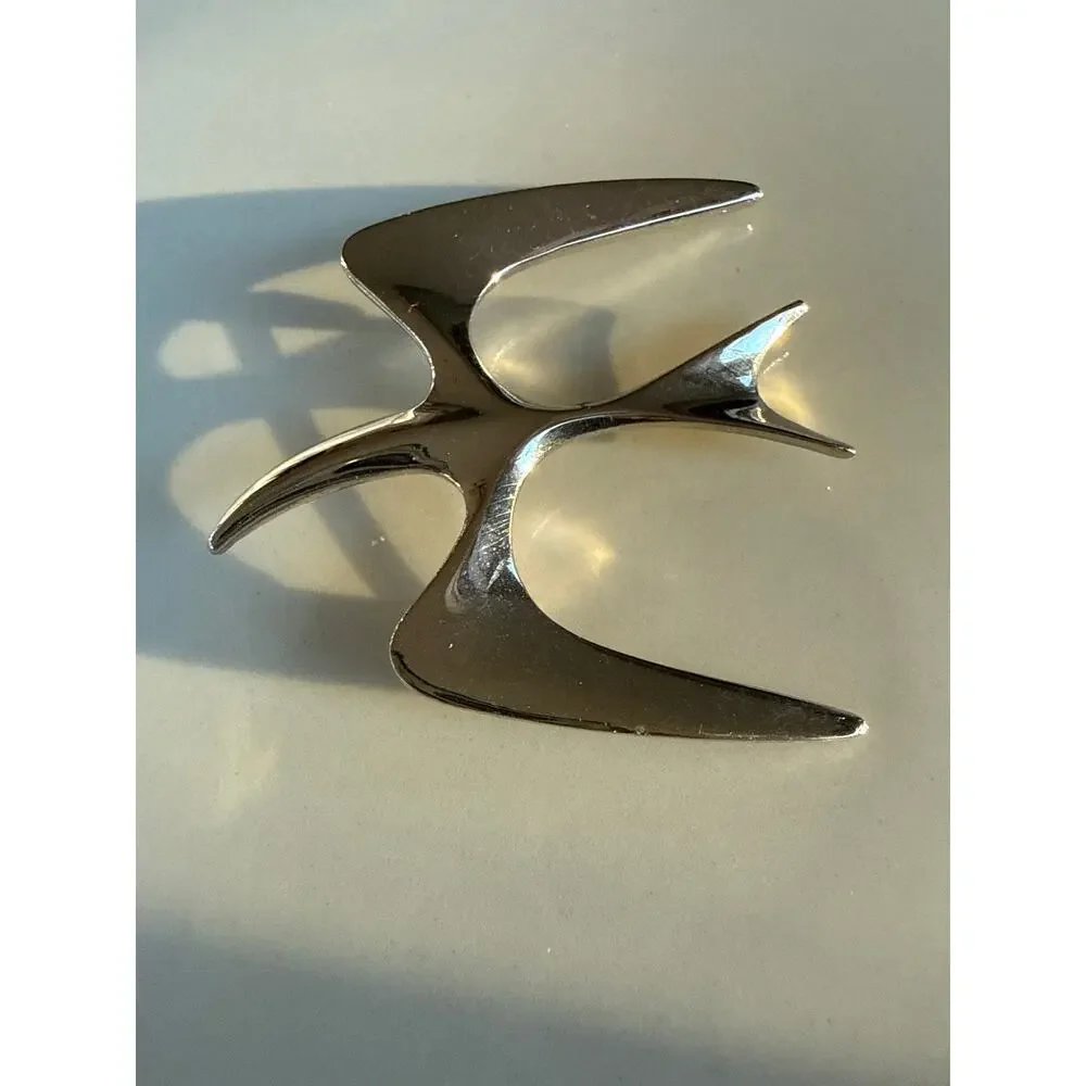 Sarah Coventry Trifari Bird in flight silver brooch